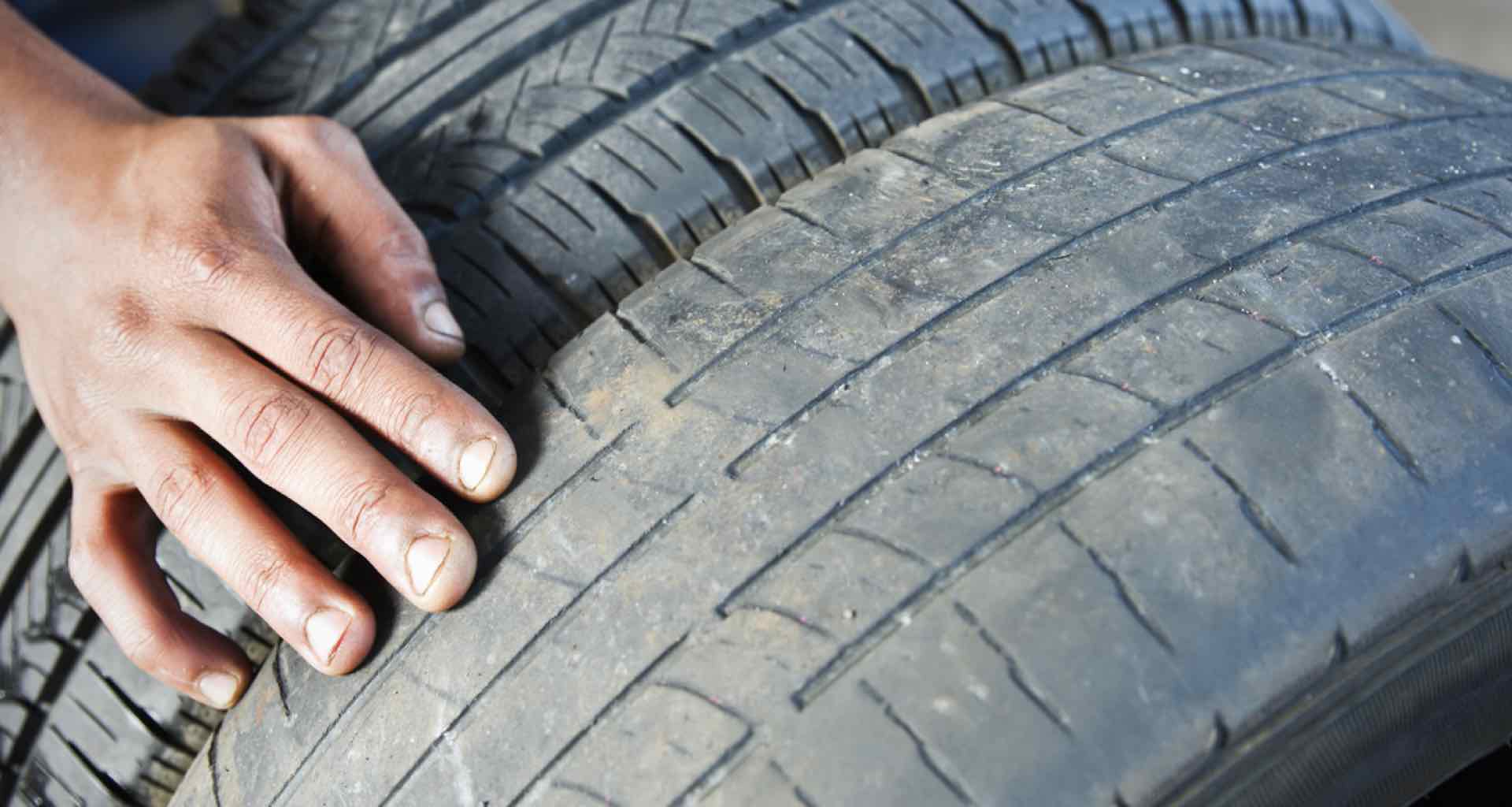 Old car tyres with worn tread